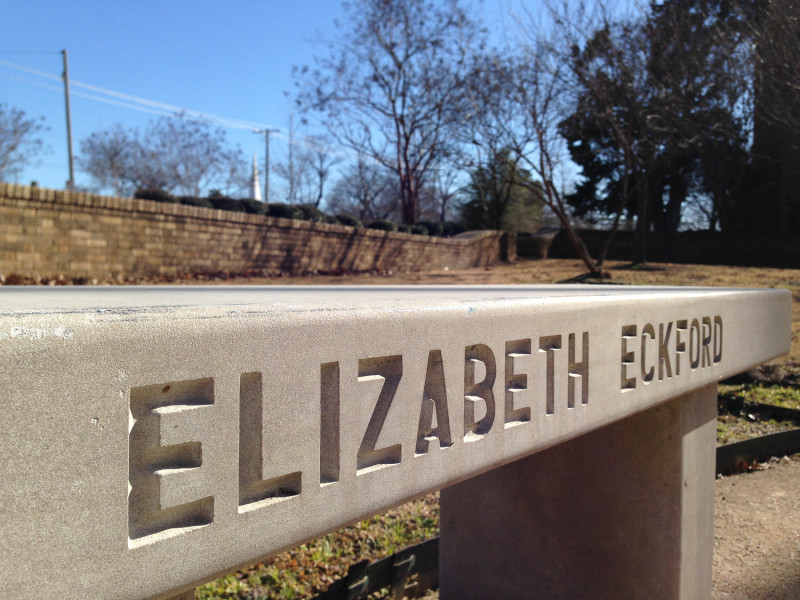Bench in front of Central High School, Little Rock, with Elizabeth Eckford's name.
